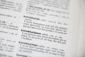 Retskrivningsordbogen med fokus på ordet korrekturlæser